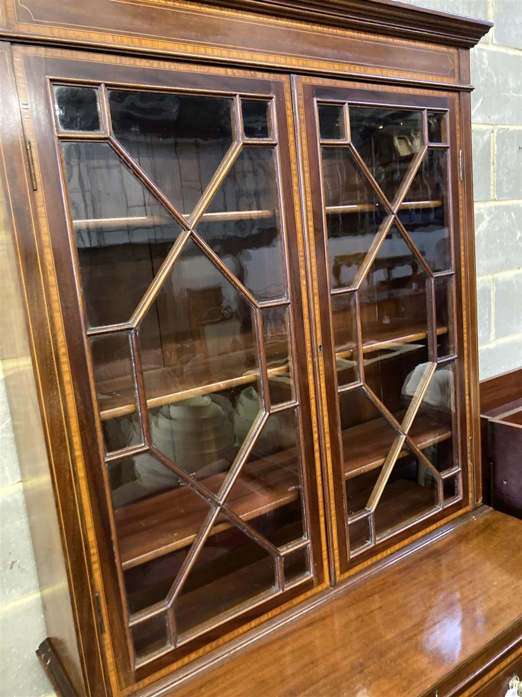 An Edwardian mahogany W&G (?) inlaid secretaire bookcase, width 107cm, depth 54cm, height 240cm